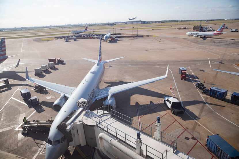 An American Airlines flight sits at terminal C29 on  Friday, July 1, 2022, at DFW Airport.
