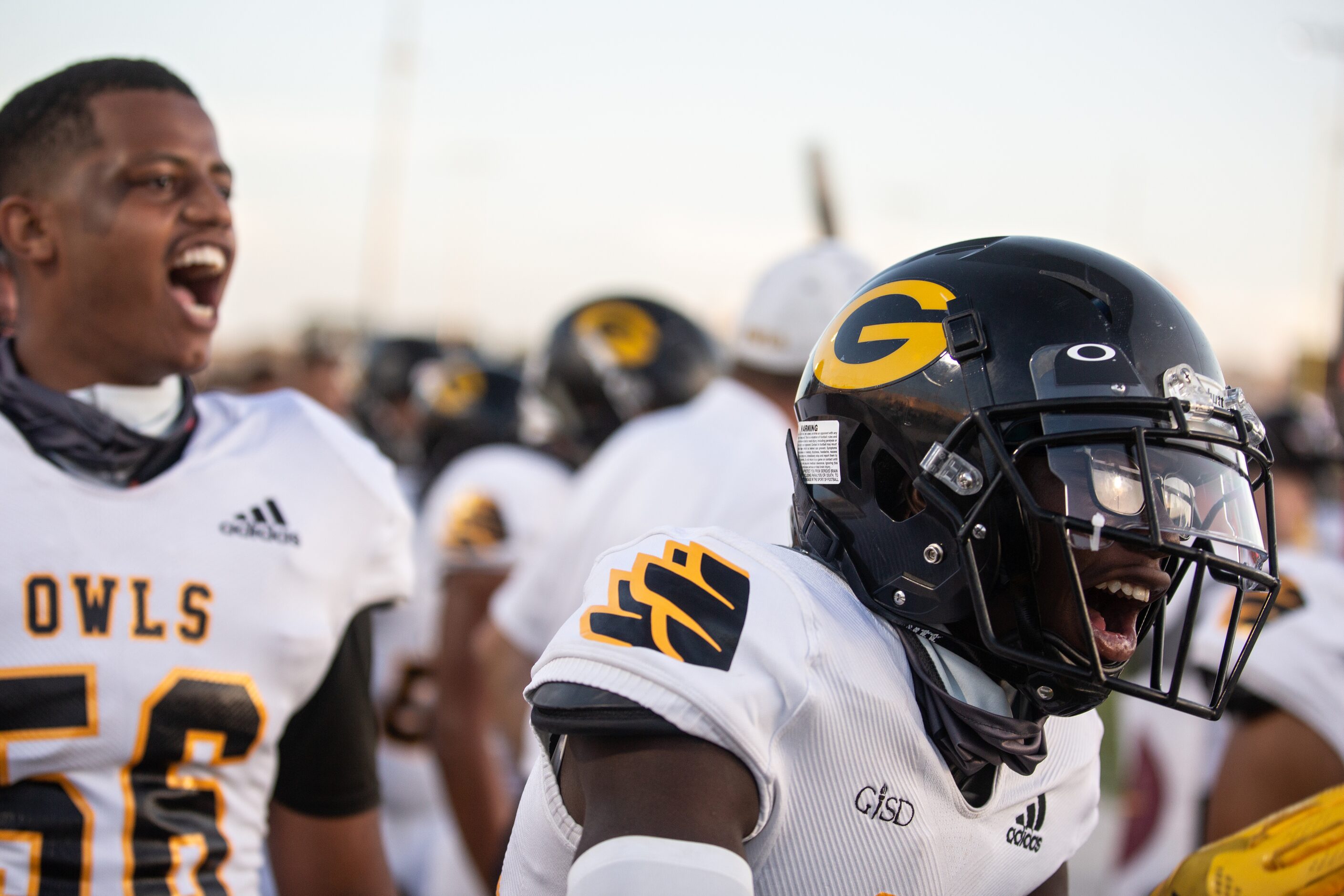 Garland High School players cheer after a touchdown during their season-opening game against...