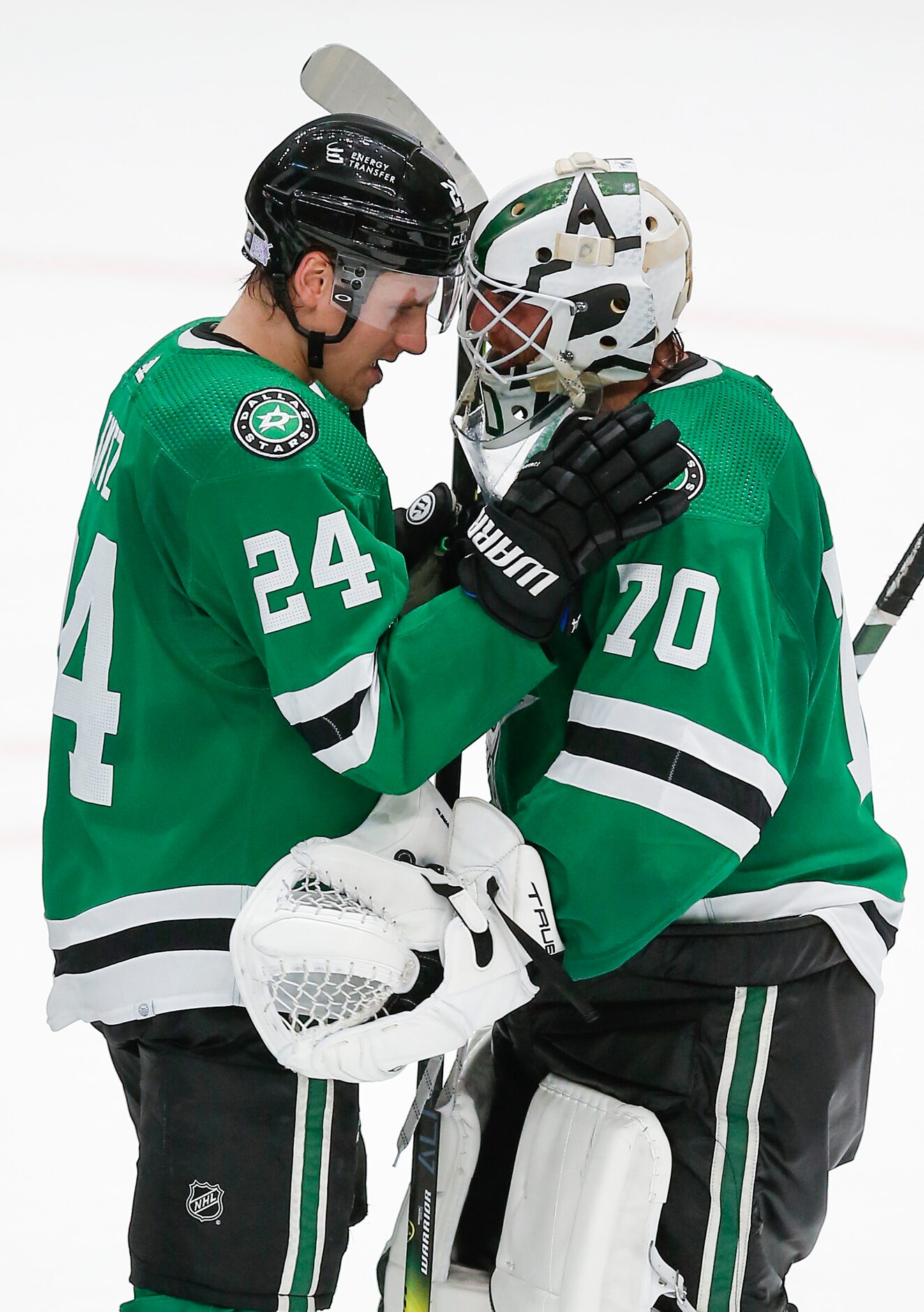 Dallas Stars forward Roope Hintz (24) and goaltender Braden Holtby (70) celebrate a 4-1 win...