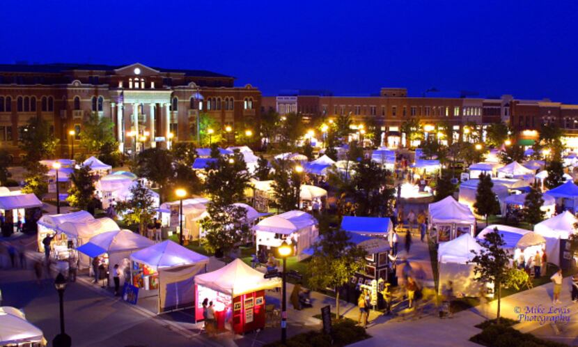 Artists display their works in the picturesque setting of Southlake Town Square during Art...