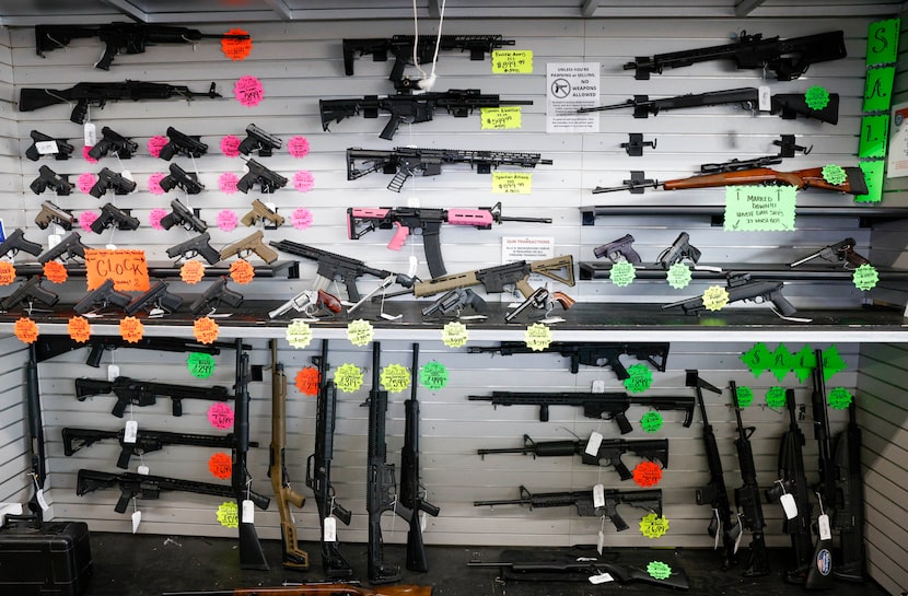 Various types of guns on display for sale at Uncle Dan’s Pawn Shop in Mesquite, Texas,...