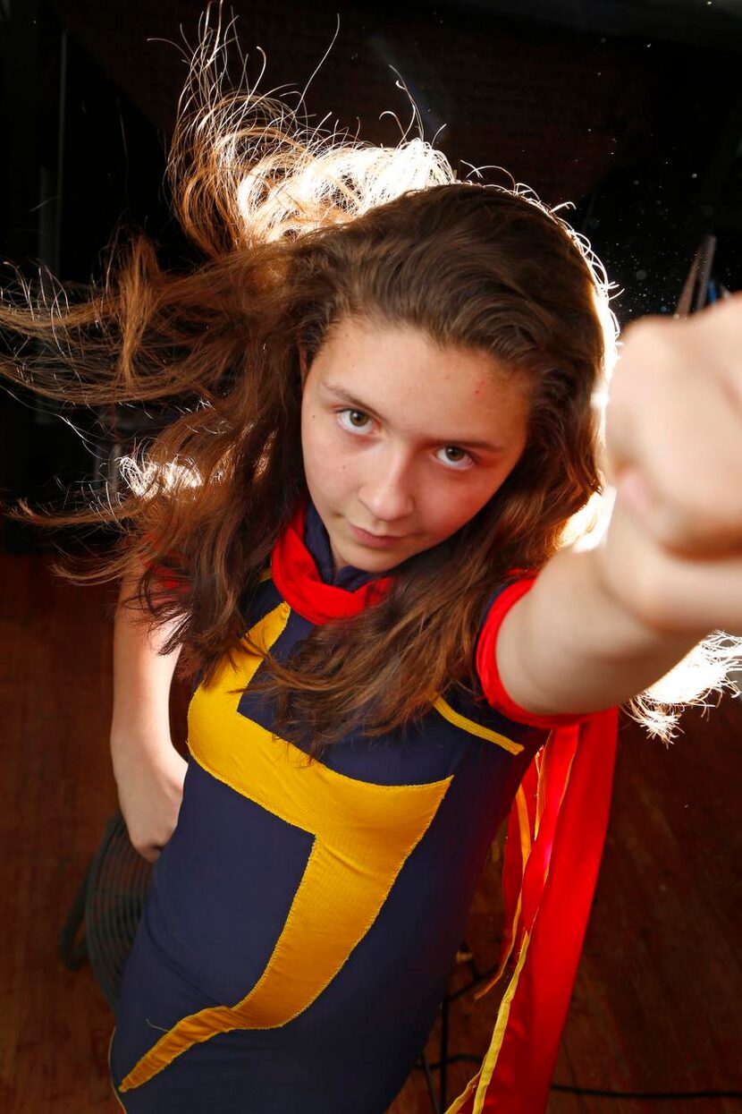 
Reese Kirkham, 11, poses with her handmade Ms. Marvel costume costume at her home in...