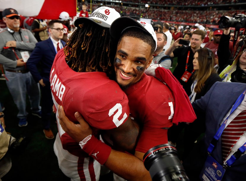 Oklahoma Sooners quarterback Jalen Hurts (1) and wide receiver CeeDee Lamb (2) celebrate...