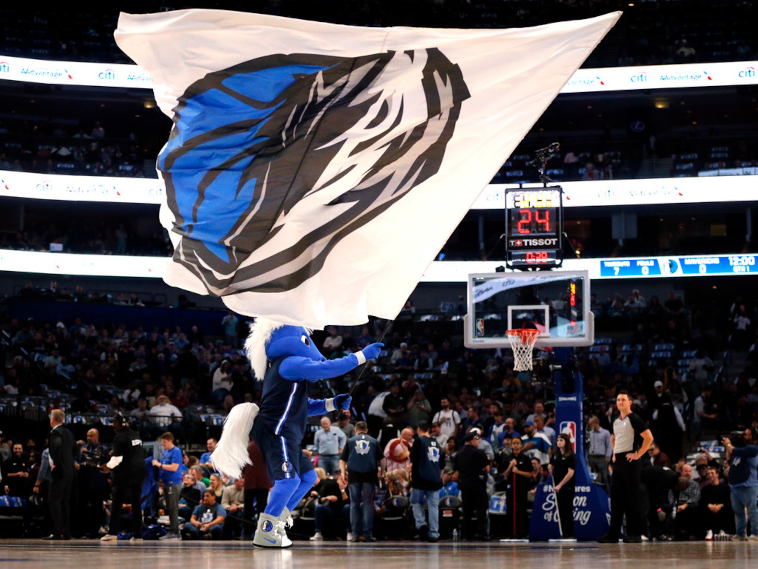 The Dallas Mavericks mascot, Champ, gets the crowd fired up before their game against the...