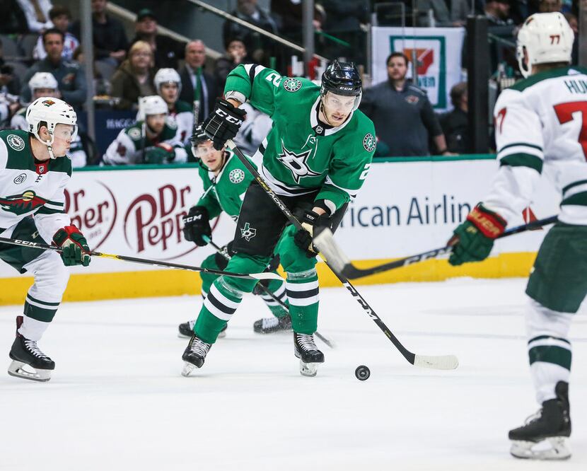 Dallas Stars defenseman Jamie Oleksiak (2) makes a break with the puck during the first...