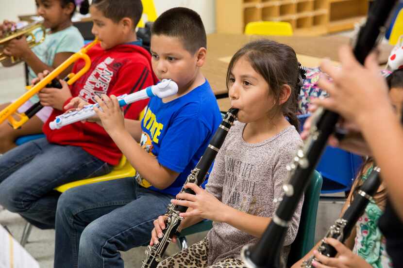 A group of students play the clarinet, flute, and trumpet as part of the DSO’s Young...