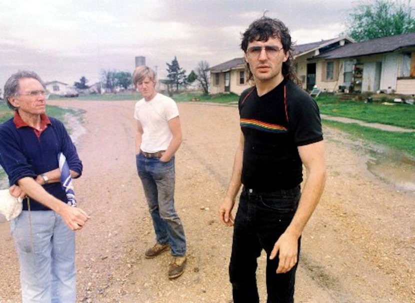 David Koresh (right) stands with his father-in-law Perry Jones (left) and his brother-in-law...