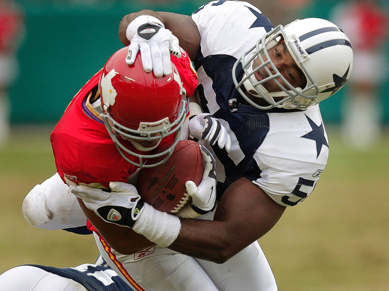Dallas Cowboys linebacker Bradie James tackles Kansas City Chiefs receiver Bobby Wade during...