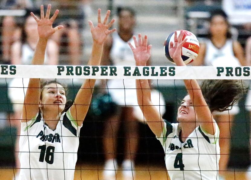 Prosper middle blocker Taylor Youtsey (16) and outside hitter Sami Jacobs (4) attempt to...