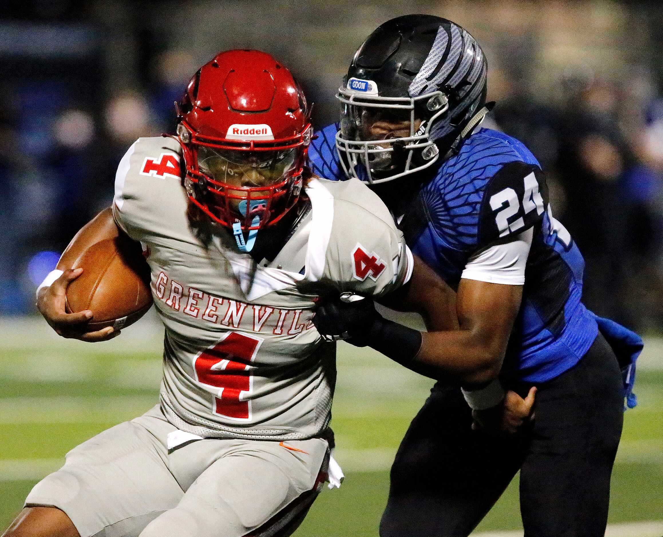 Greenville High School quarterback Brandon Stephens (4) is tackled by North Forney High...