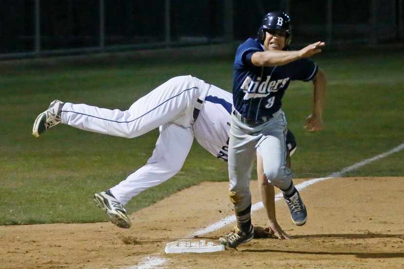 Bell's Kyle Brousarrd (3) heads home with the tying run as Flower Mound third baseman Tim...