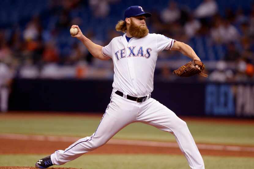 ST. PETERSBURG, FL - AUGUST 30:  Andrew Cashner #54 of the Texas Rangers throws a pitch...