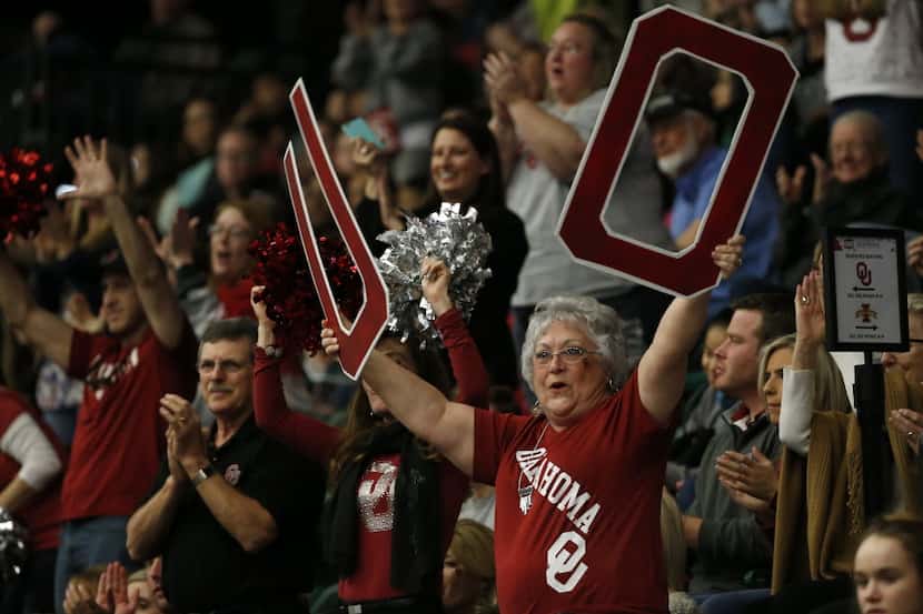 Oklahoma fans cheer for their team during the Big 12 Gymnastic Championships at Dr Pepper...