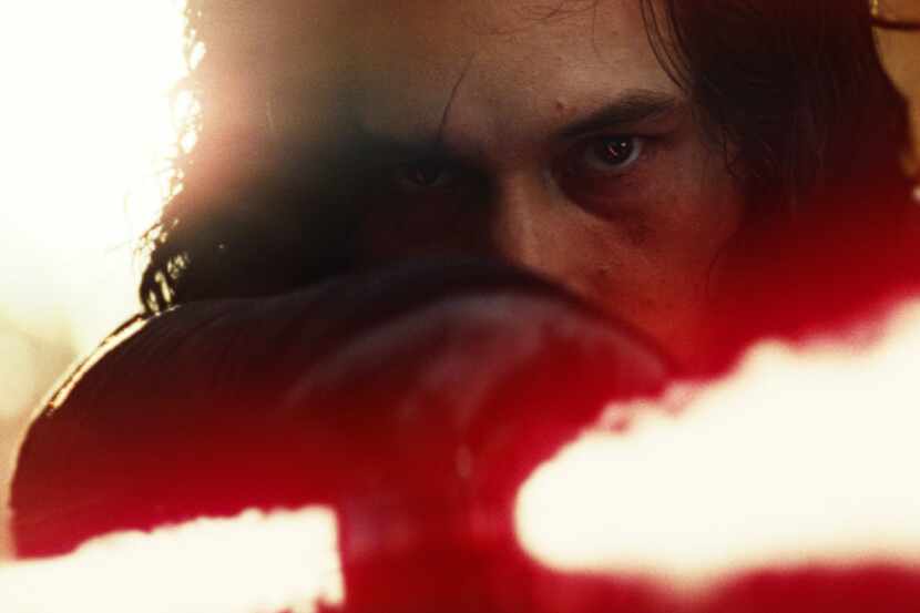 This image released by Lucasfilm shows Adam Driver as Kylo Ren in a scene from Star Wars:...