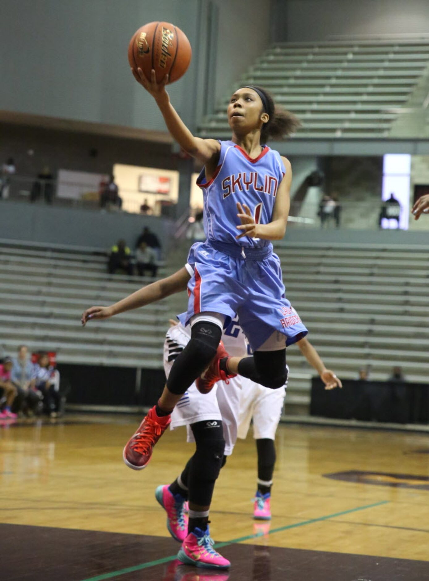 Skyline guard Christalah Lyons shoots a fingeroll during second half of the region II AAAAAA...