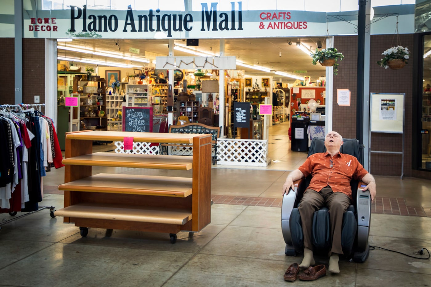 Vendor Don D. Hargrave relaxes in a massage chair.