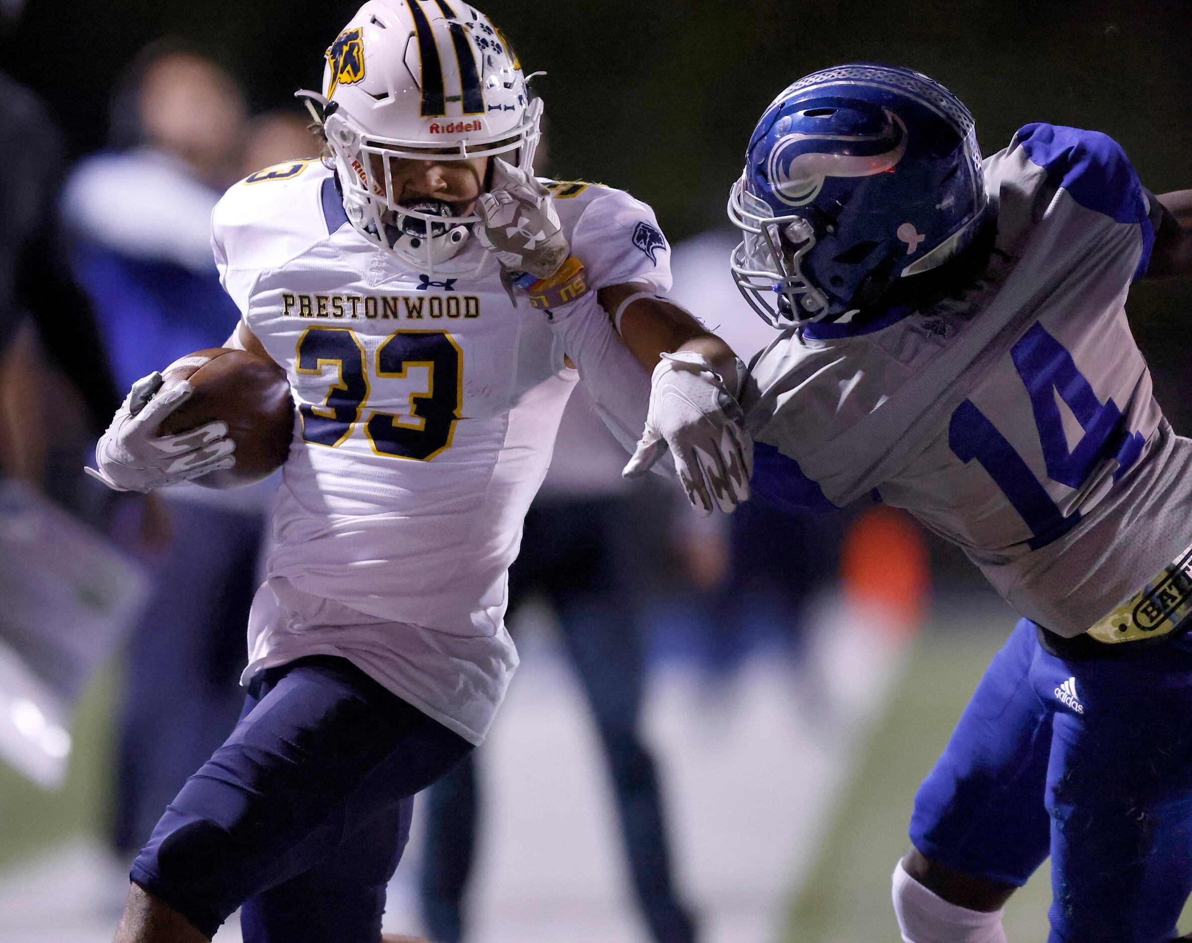 Plano Prestonwood Christian Academy running back Jaden Lindsay (33) is grabbed by the face...