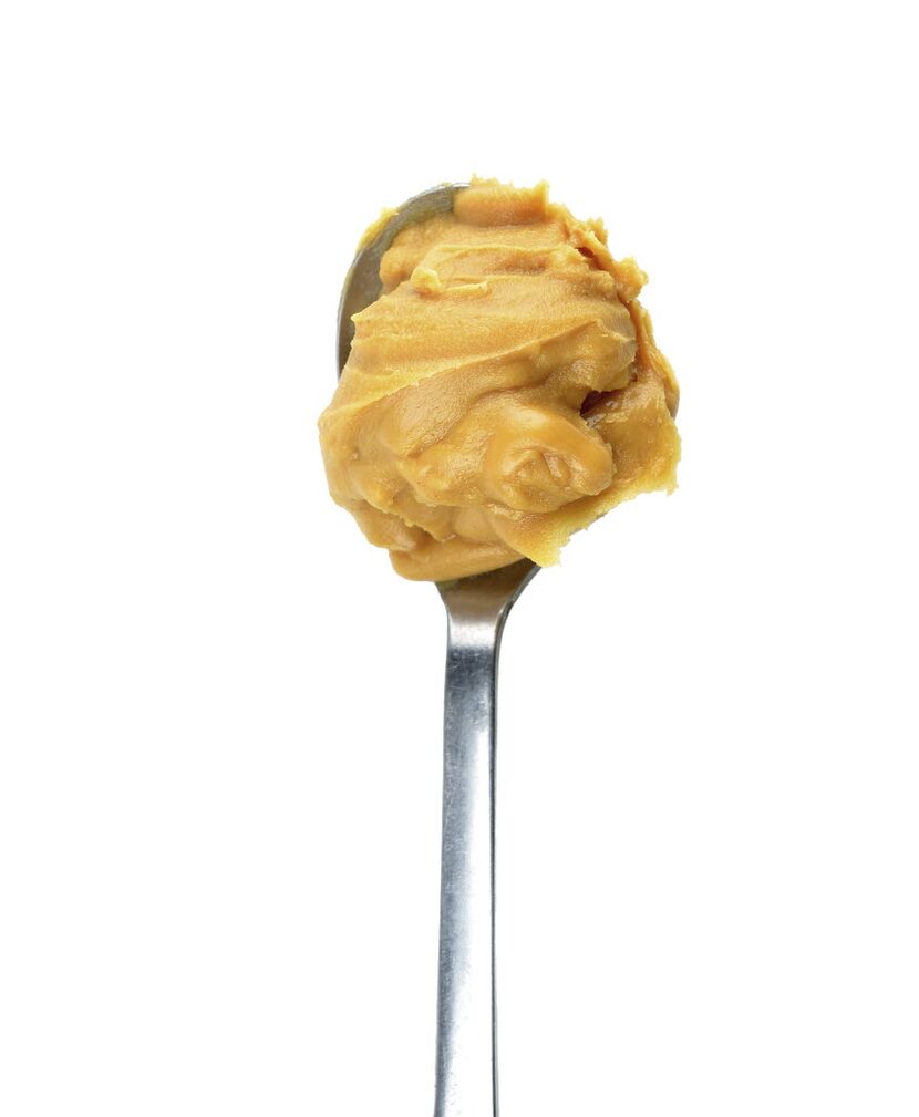 Creamy peanut butter in a spoon