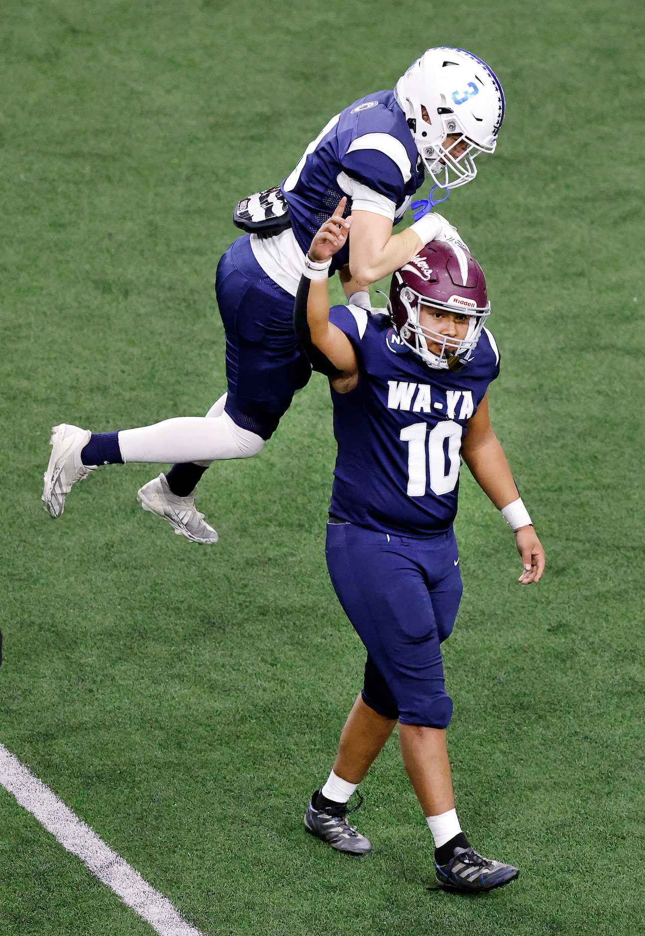 Wa-Ya  kicker Trajan Isaac (10) of Spring Hill High (TN) is congratulated by Cooper O’Neal...