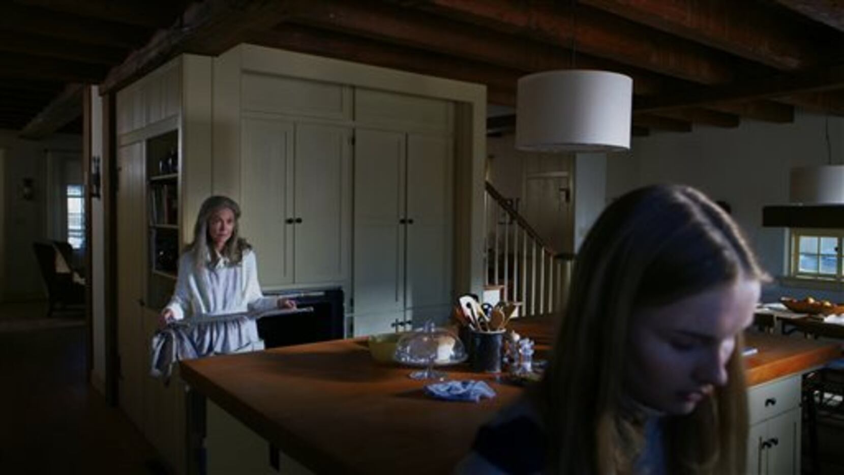 In this image released by Universal Pictures, Olivia DeJonge, foreground, and Deanna Dunagan...