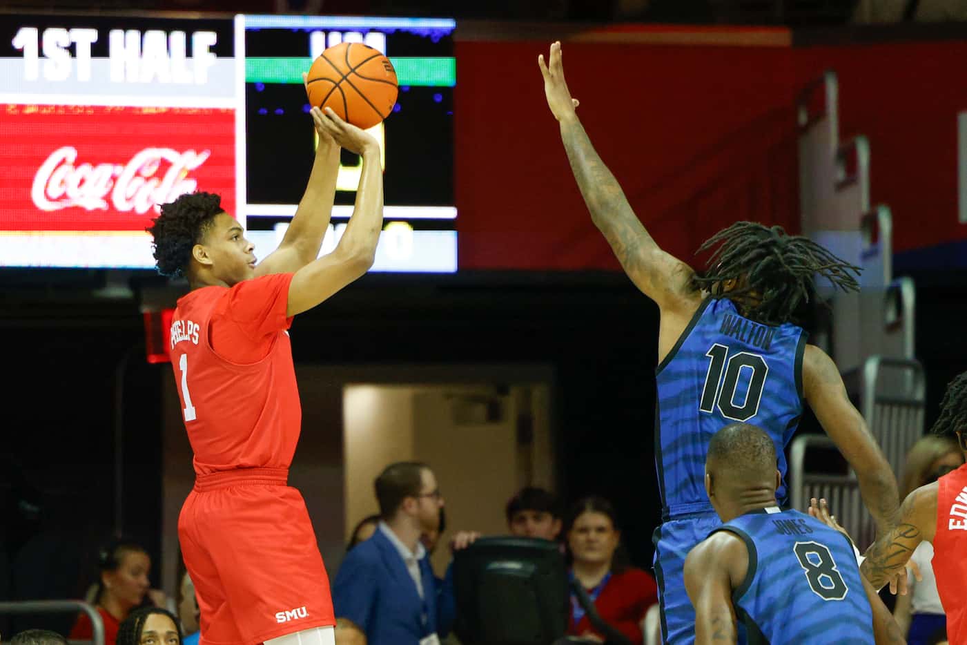 SMU guard Zhuric Phelps (1) shoots over Memphis guard Joe Cooper (20) during the first half...