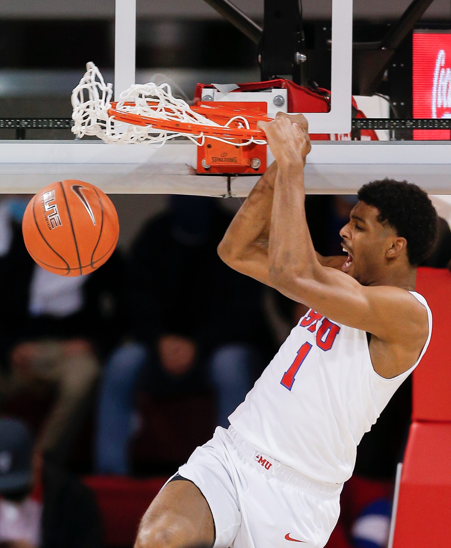 SMU forward Feron Hunt (1) dunks during the first half of a college basketball game against...