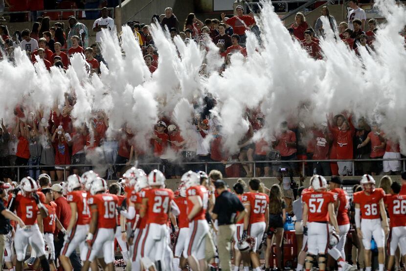 TXHSFB Coppell's student section uses baby powder to celebrate the start of the first half...