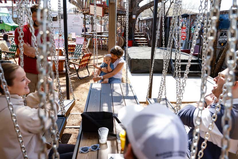 Truck Yard in Dallas' Lowest Greenville has a new "swing set table" in the backyard.