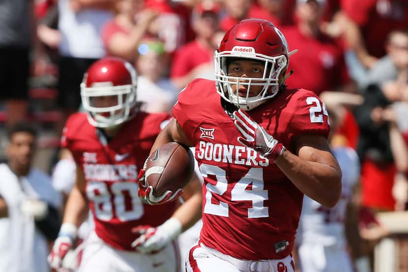 Oklahoma running back Rodney Anderson carries during the annual Oklahoma NCAA college spring...