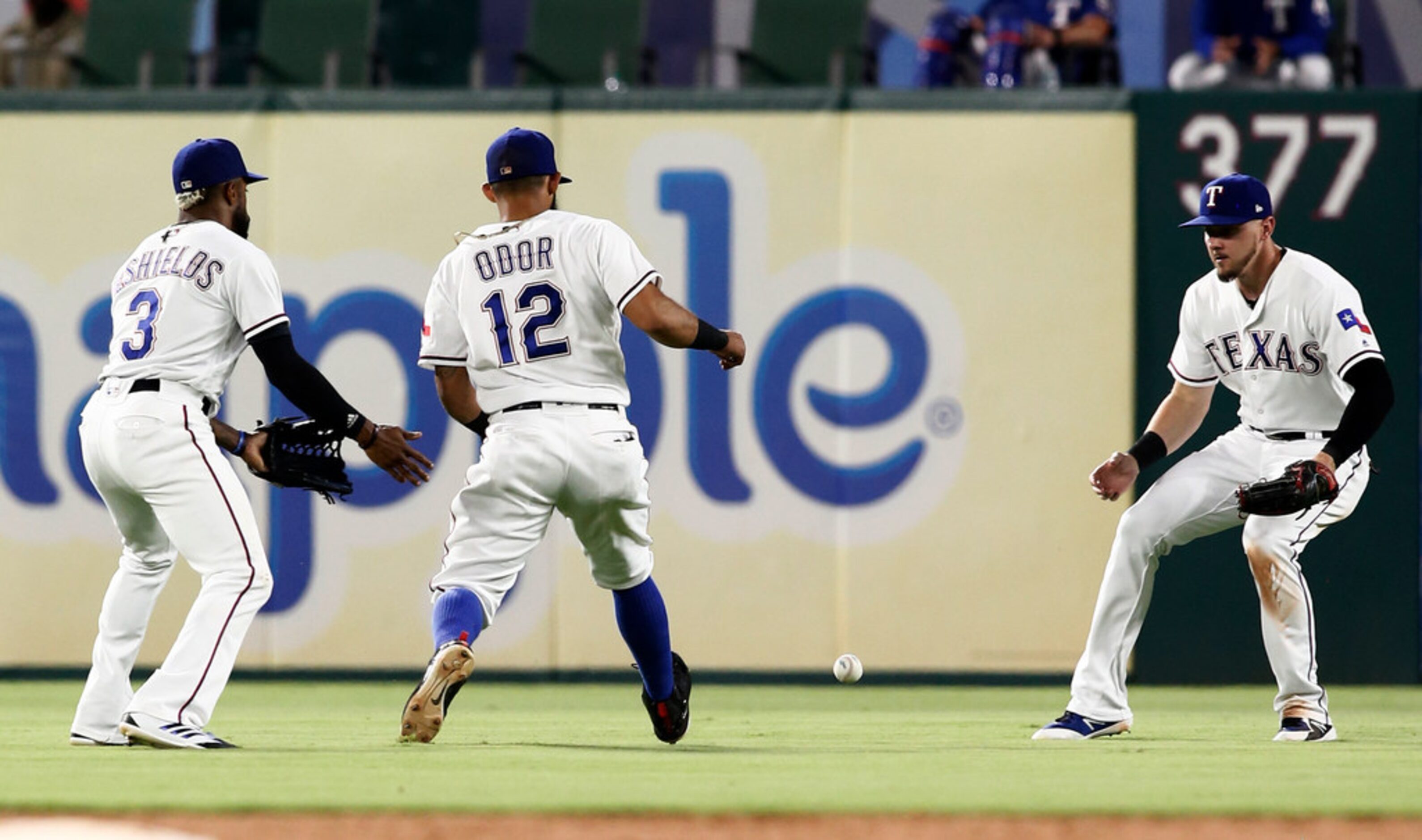 Texas Rangers center fielder Delino DeShields (3), second baseman Rougned Odor (12) and...