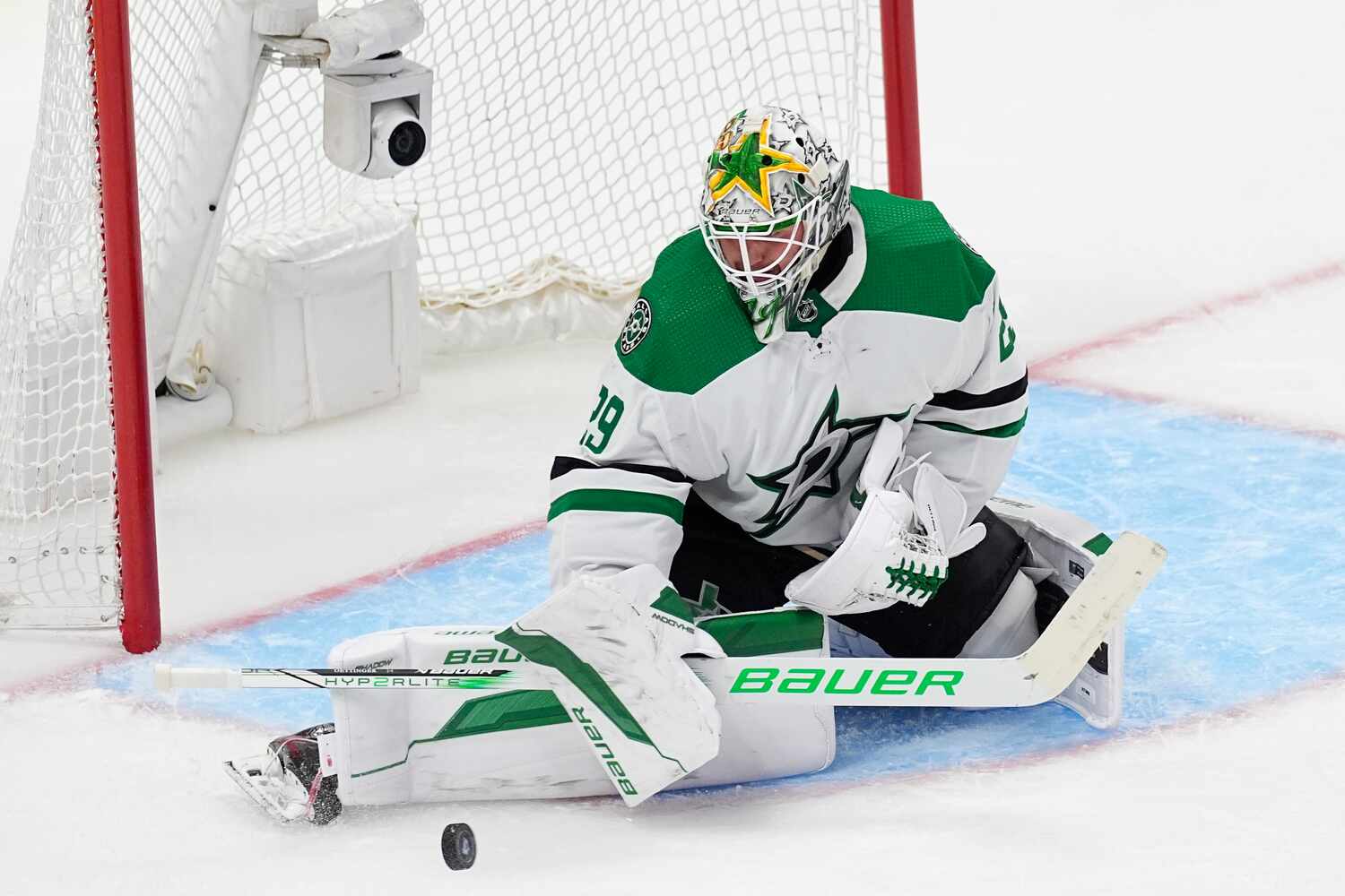 Dallas Stars goaltender Jake Oettinger stops a Colorado Avalanche shot during the third...