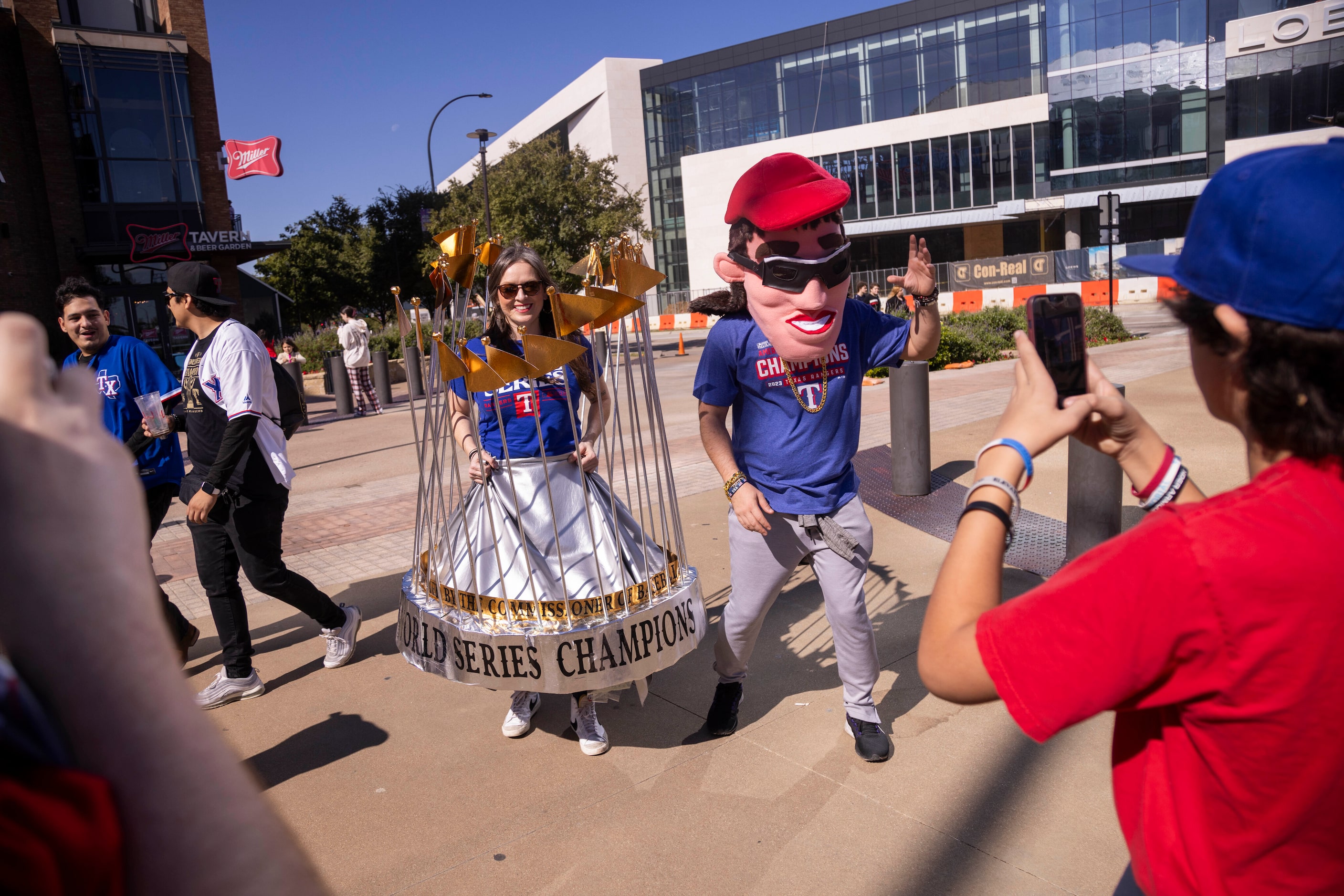 (From center left) Candice Stinnett from Fort Worth and Carlos Bambinos of Dallas pose for a...