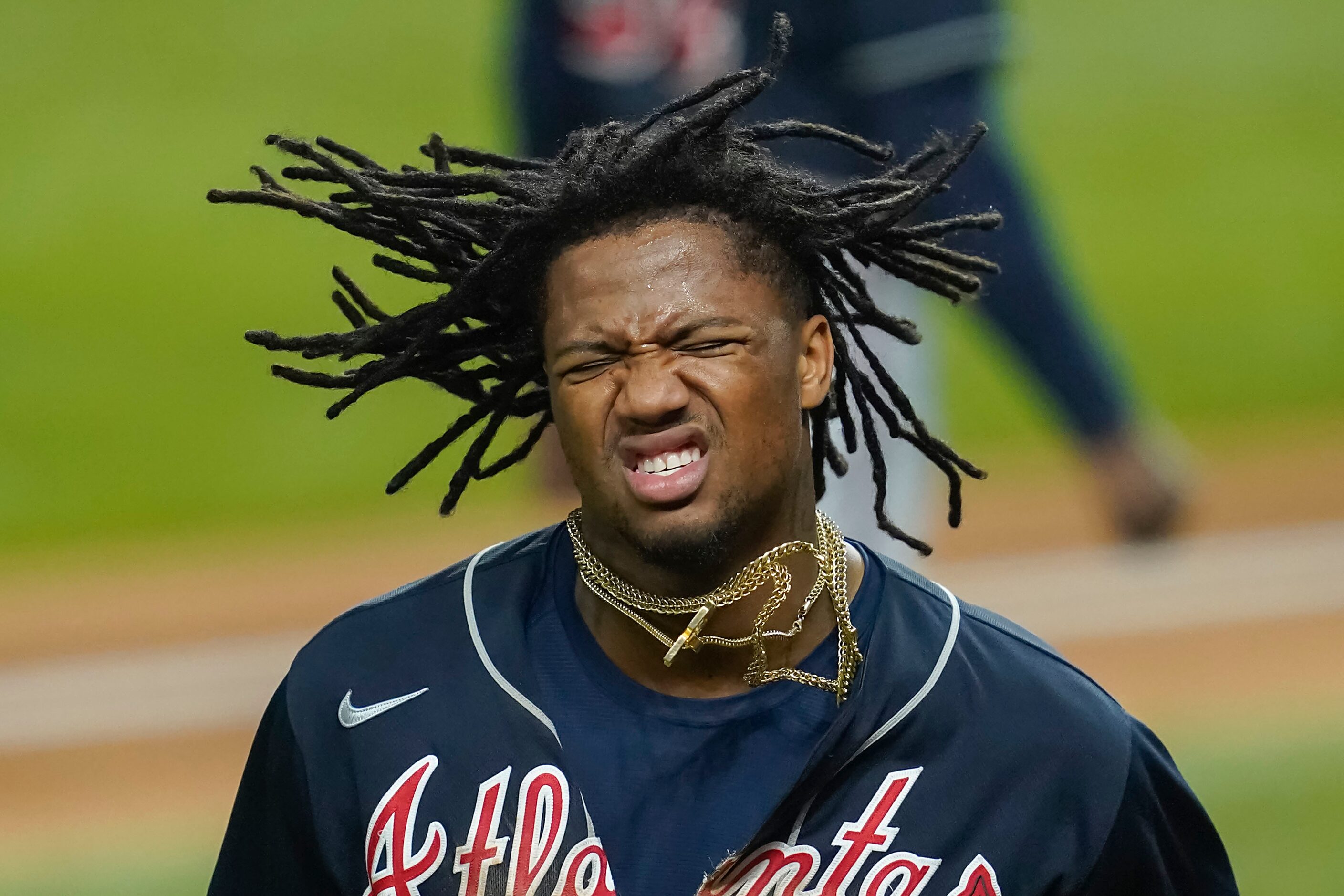 Atlanta Braves right fielder Ronald Acuna Jr. (13) grimaces after scoring on a single by...