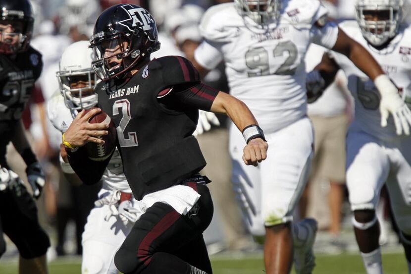 Texas A&M quarterback Johnny Manziel (2) sprints into the end zone for a touchdown in the...