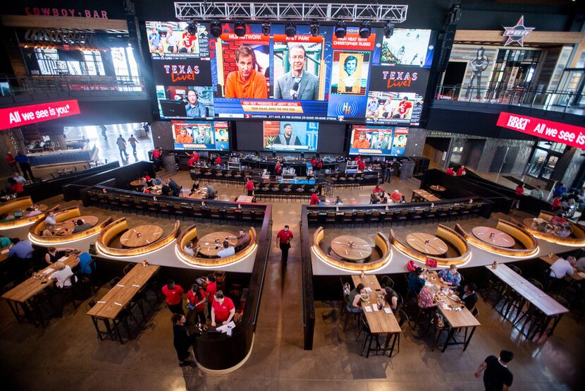 The wall of TVs at Texas Live measures 100 feet from corner to corner. On New Year's Eve,...