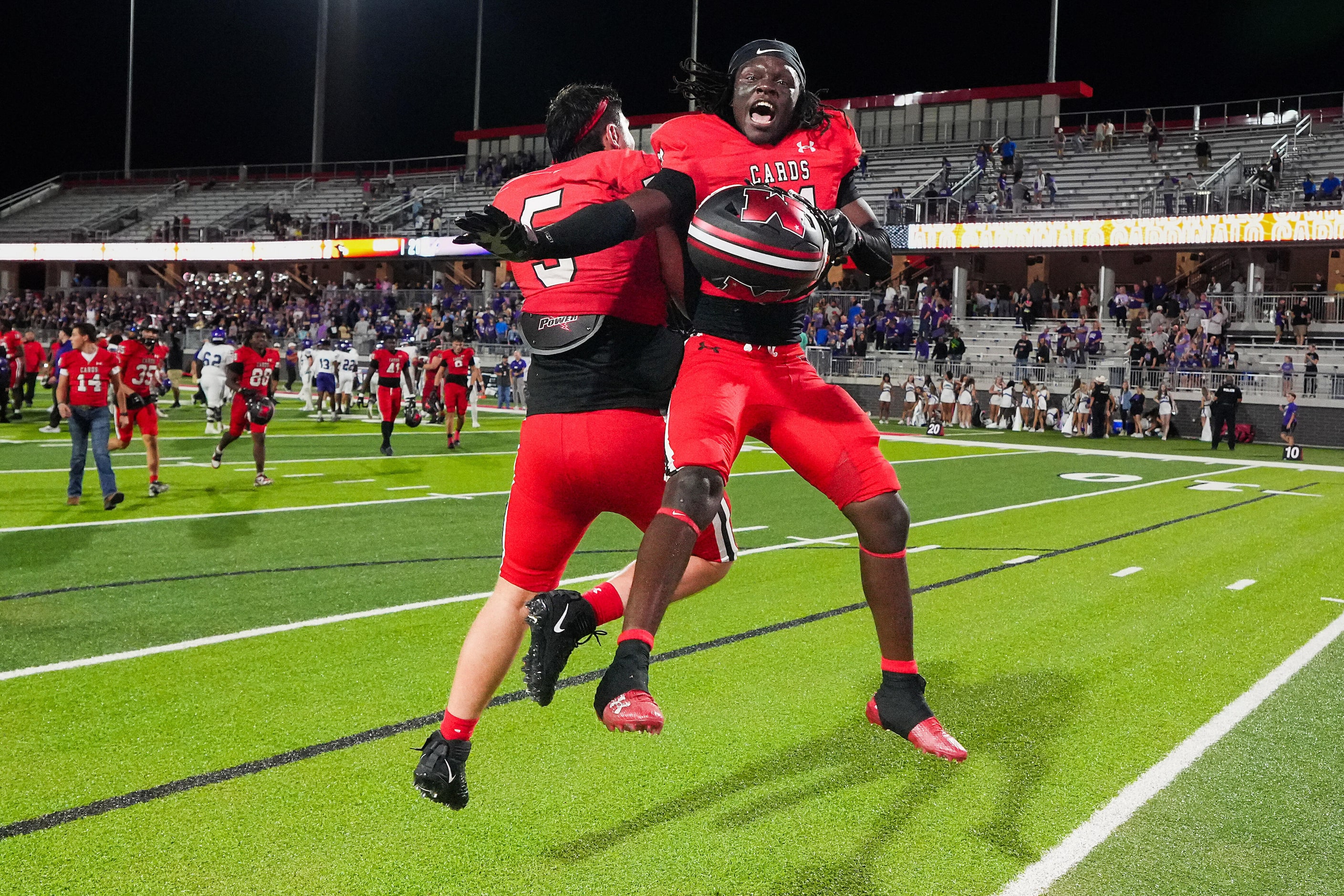 Melissa defensive back Dumi Gatson (right) celebrates with defensive lineman Jacob Wasserman...