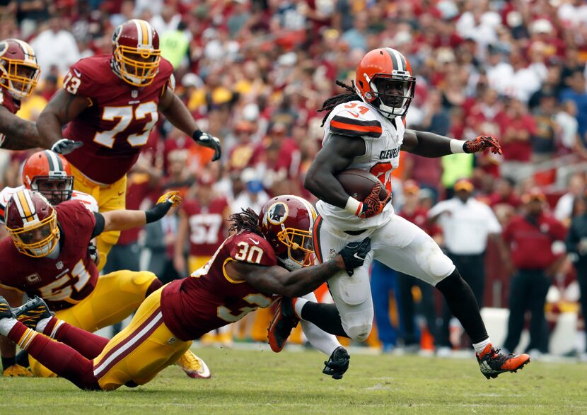 Washington Redskins strong safety David Bruton (30) tackles Cleveland Browns running back...