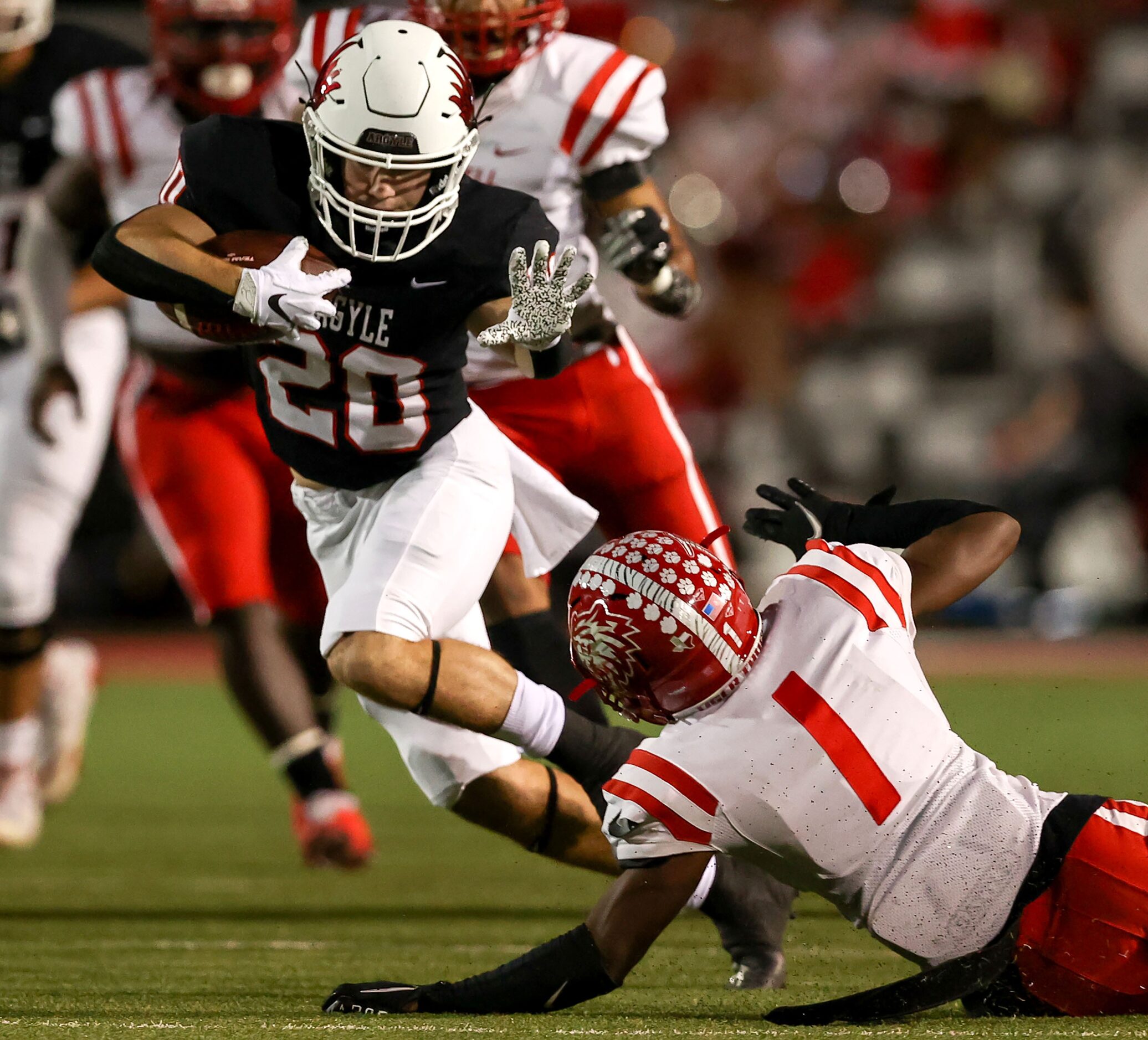 Argyle running back Landon Farris (20) tries to get past Terrell cornerback Kanye Nix (1)...