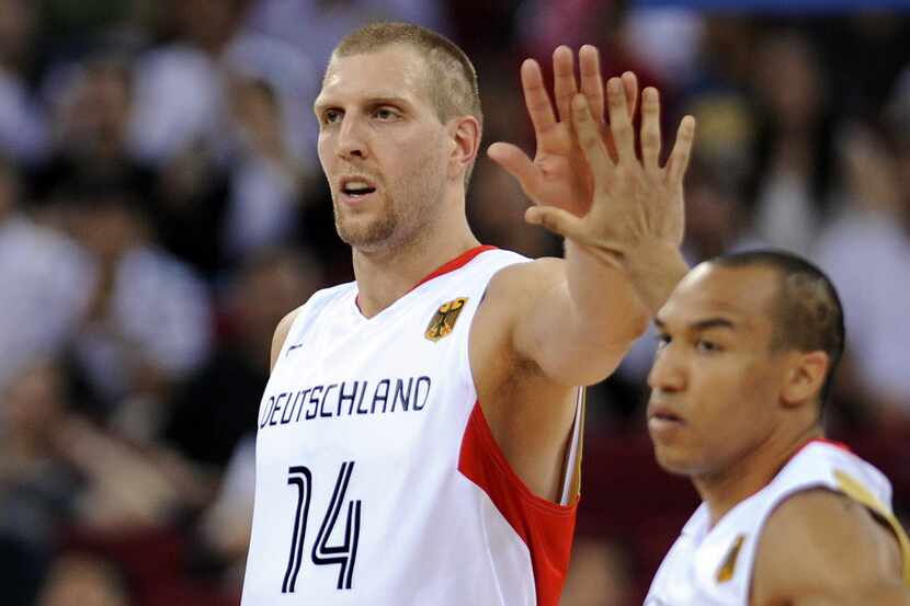 Germany's Dirk Nowitzki (L) and Demond Green celebrate a point during a 2008 Beijing Olympic...