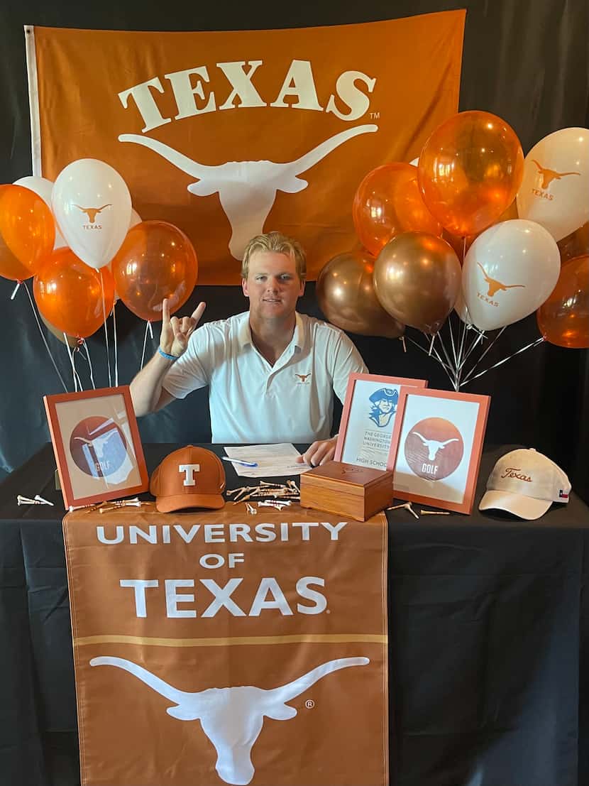 Tommy Morrison of Frisco gives the Hook 'em Horns sign after signing on with Texas on...
