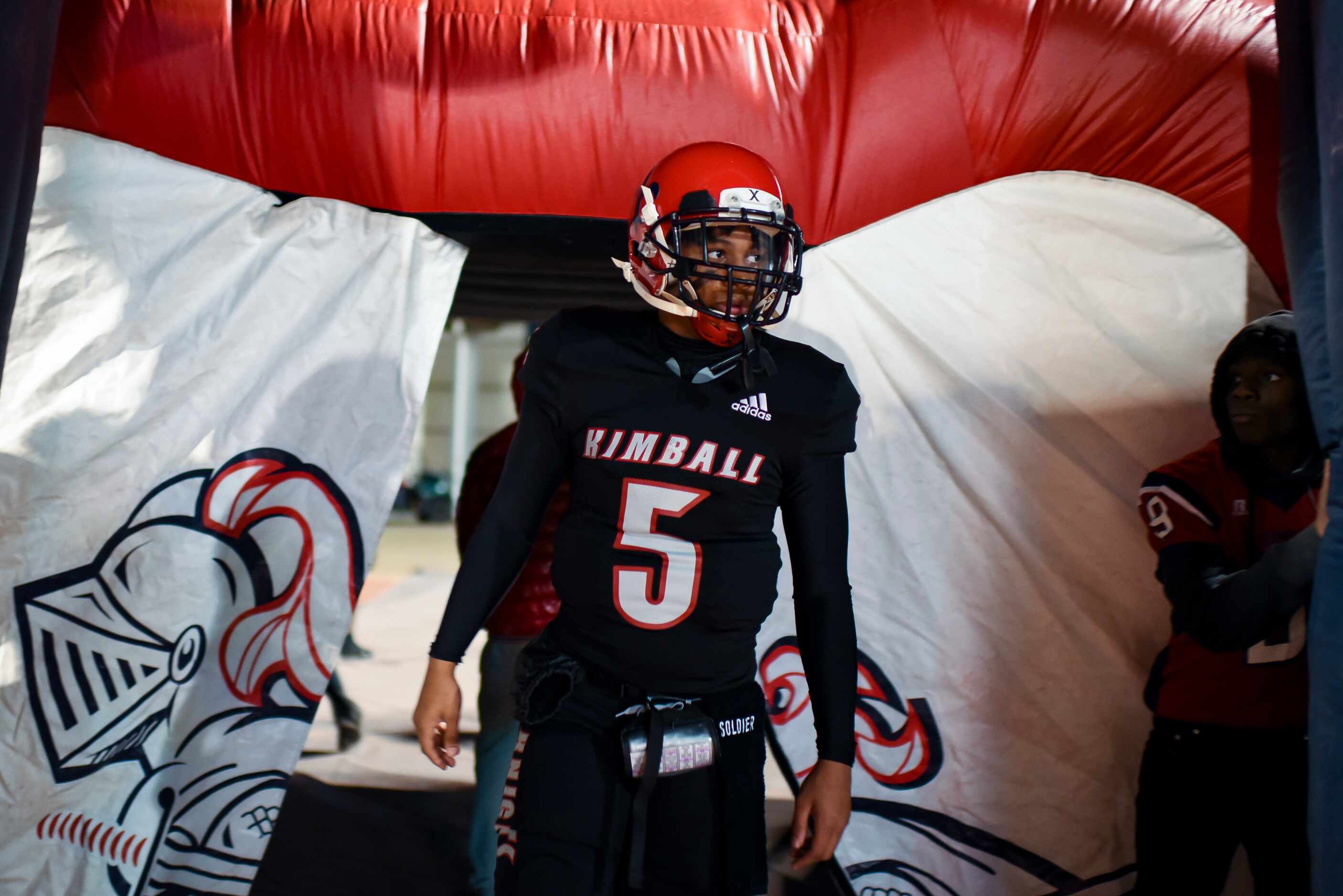 Kimball sophomore Jacarion Sauls (5) walks onto the field prior to the start of the District...