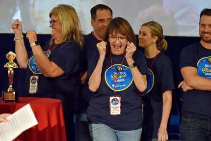 Christi Erpillo, center, reacts as her family's fried hoppin' John cake is announced as a...