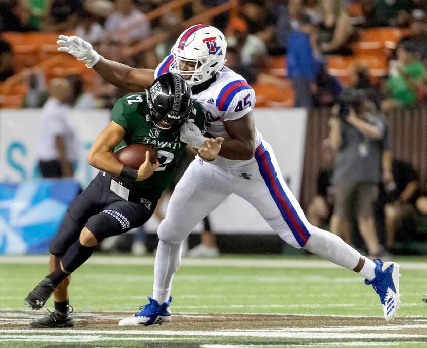 FILE - Louisiana Tech defensive end Jaylon Ferguson (45) sacks Hawaii quarterback Chevan...