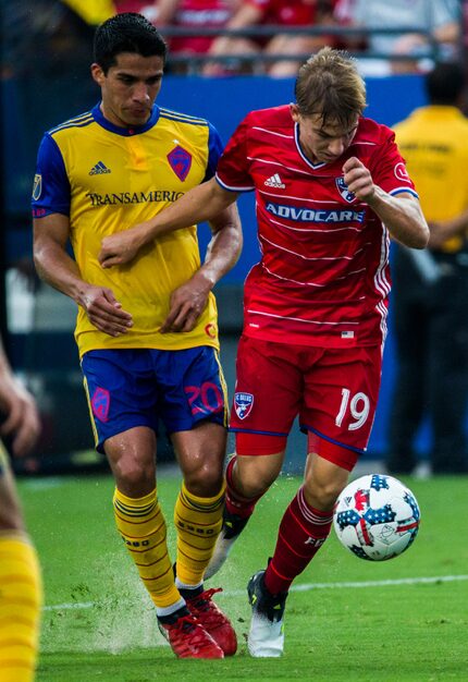 FC Dallas midfielder Paxton Pomykal (19) kicks the ball ahead of Colorado Rapids midfielder...