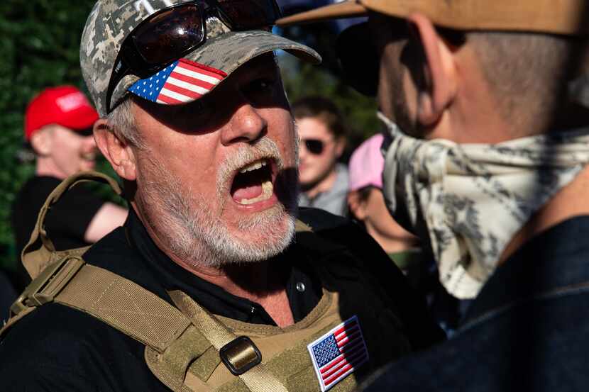 A supporter of President Donald Trump shouted at counter-protesters outside the Texas State...