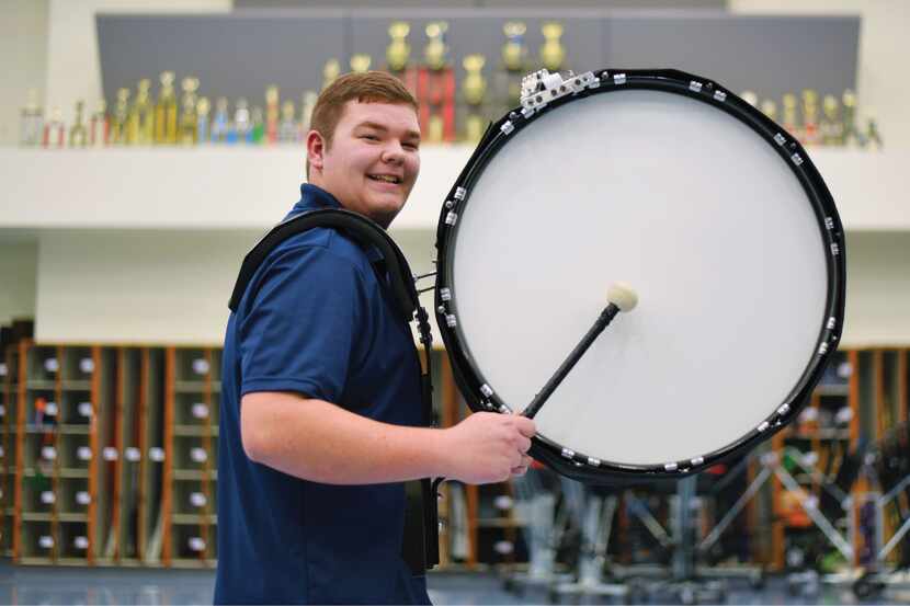 Luke of McKinney North High School plays his bass drum attached to his body.