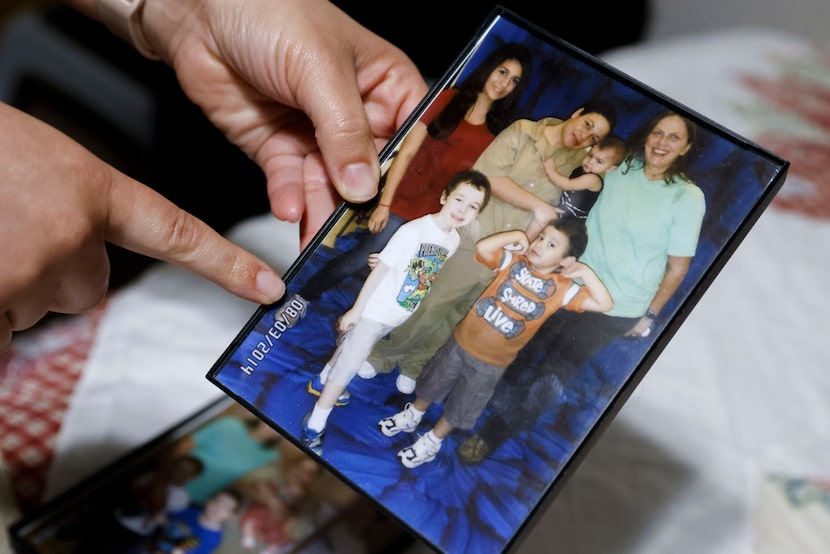 Perry shows a photo of her family taken during her time in prison at Federal Medical Center,...