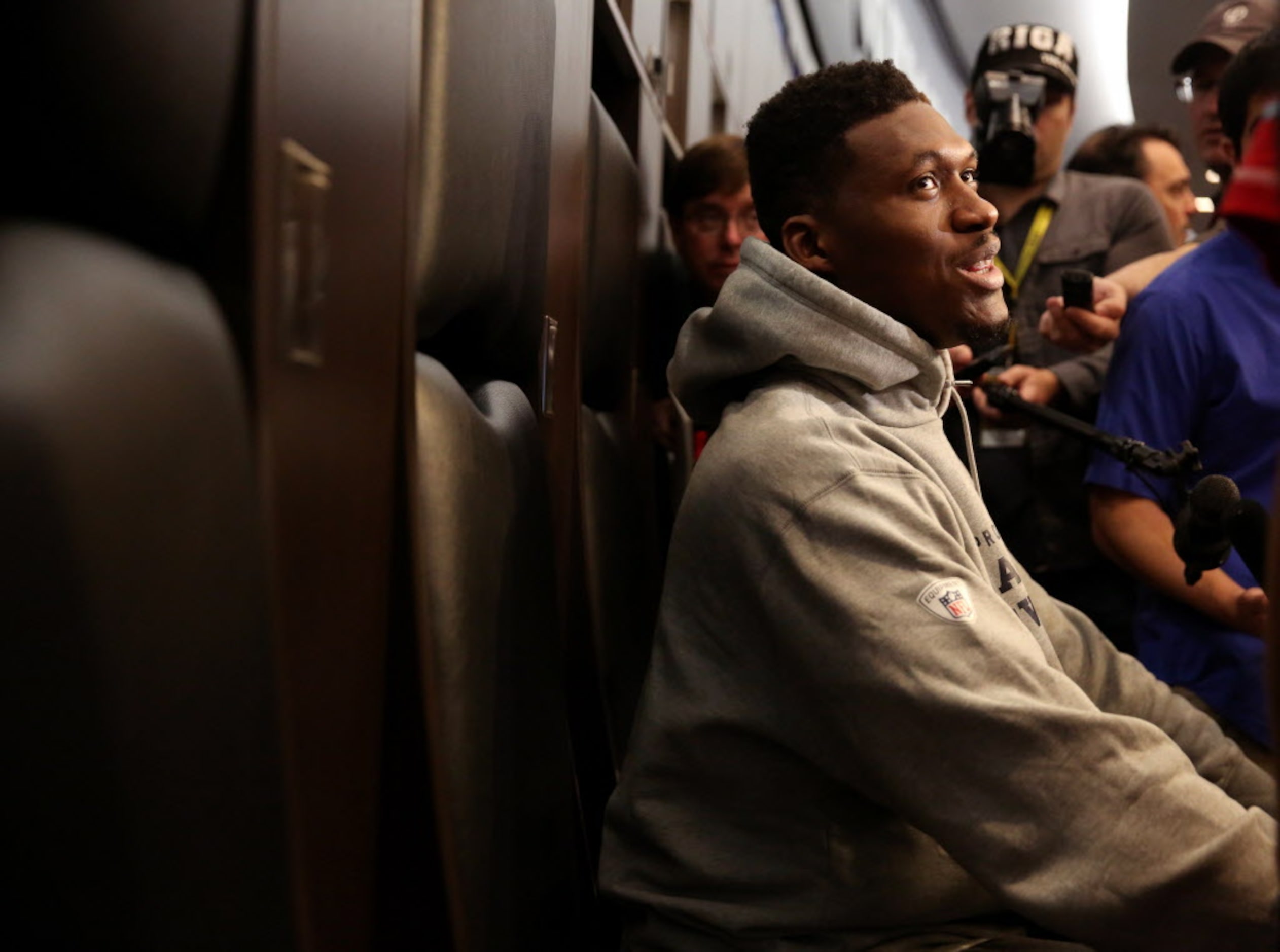 Dallas Cowboys defensive end David Irving talks to the media during locker room clean out at...