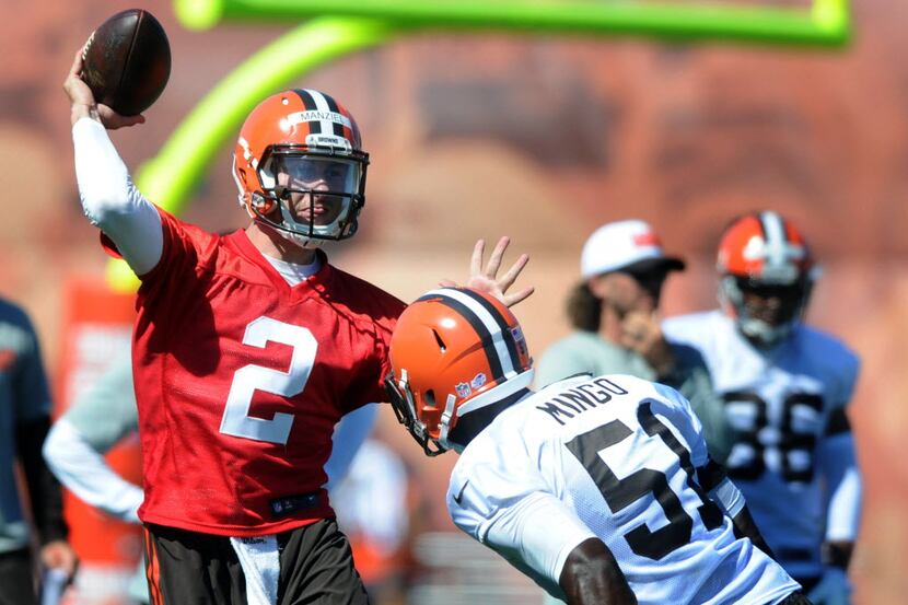 Jul 30, 2015; Berea, OH, USA; Cleveland Browns quarterback Johnny Manziel (2) throws over...