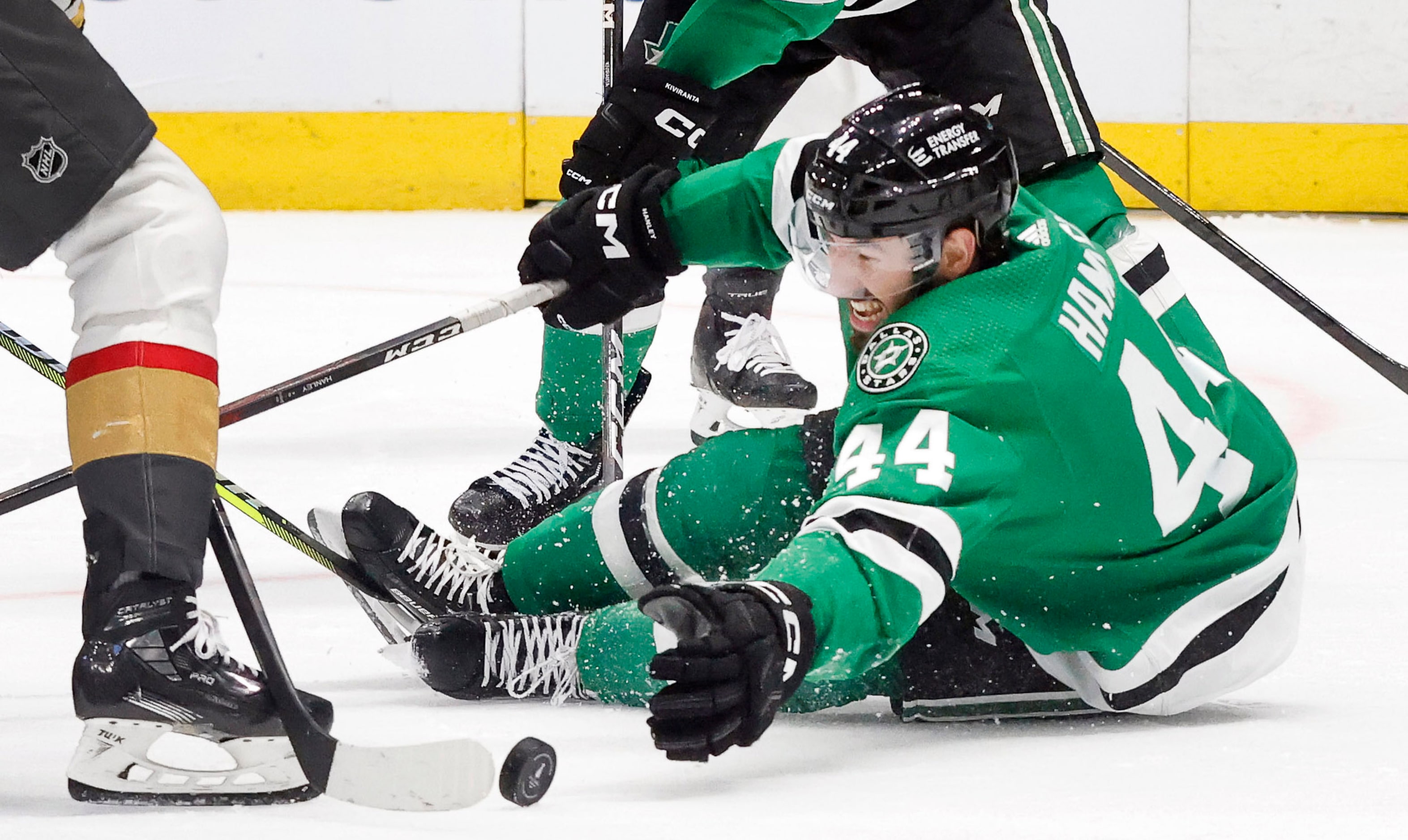 Dallas Stars defenseman Joel Hanley (44) dives for a loose puck as Vegas Golden Knights...